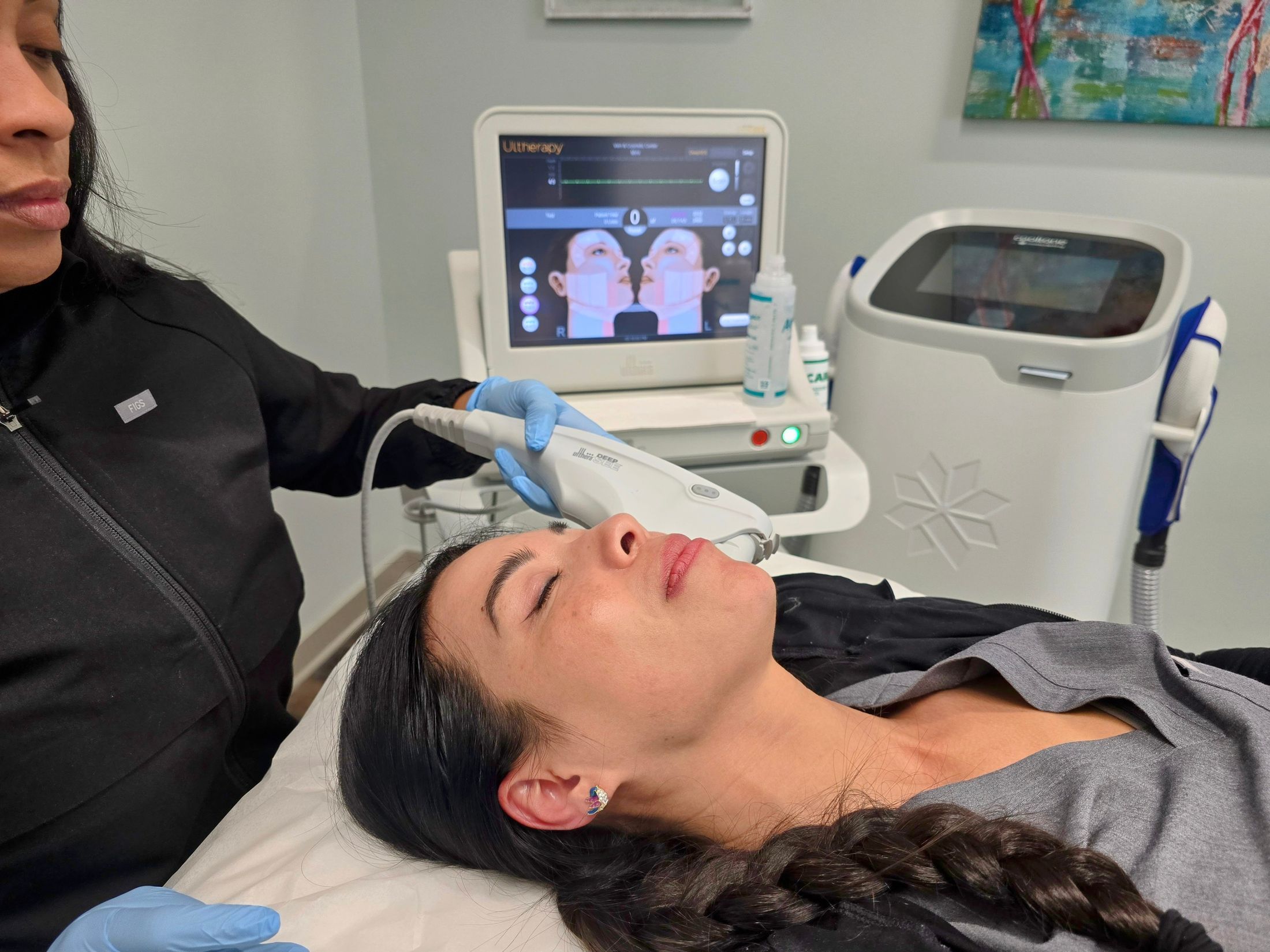 Woman applying skincare while looking in mirror.