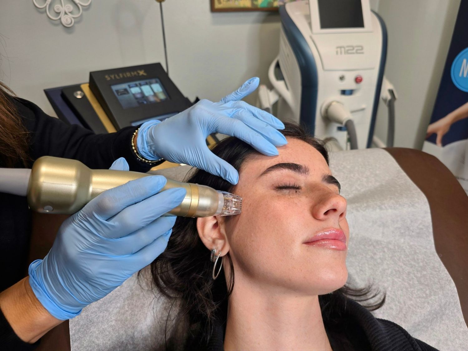 Woman receiving a facial treatment in spa.