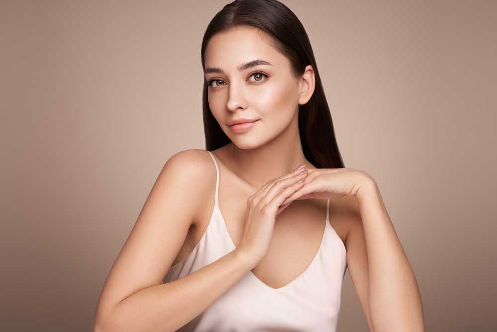 Woman with long hair and natural makeup.