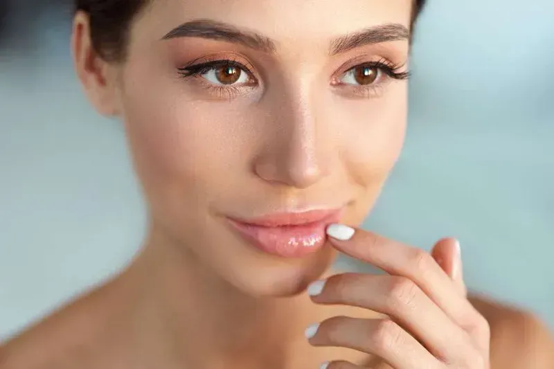 Close-up of a woman's serene face.